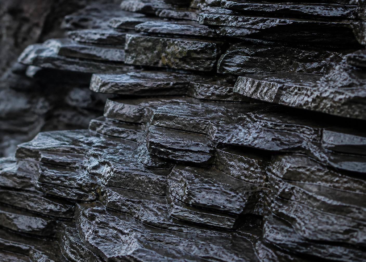 Layered wet slate stones